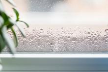 Condensation forming on the window of a humid house