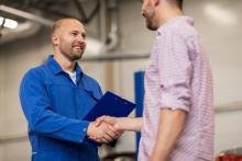 man shaking a tech's hand