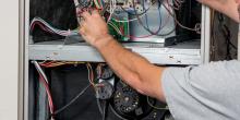 man working on a furnace