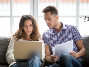 A couple looking at bills
