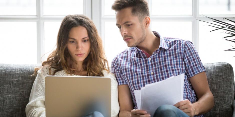 A couple looking at bills