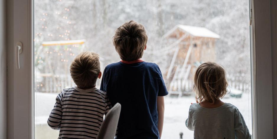 kids looking at snow