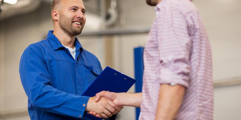 man shaking a tech's hand